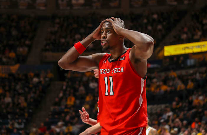 Texas Tech Red Raiders forward Bryson Williams (11) reacts to a call during the second half against the West Virginia Mountaineers at WVU Coliseum.